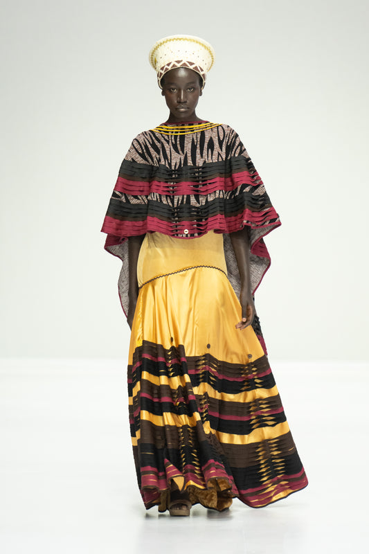 Mandulu Cape worn with a gold Mamlambo skirt
