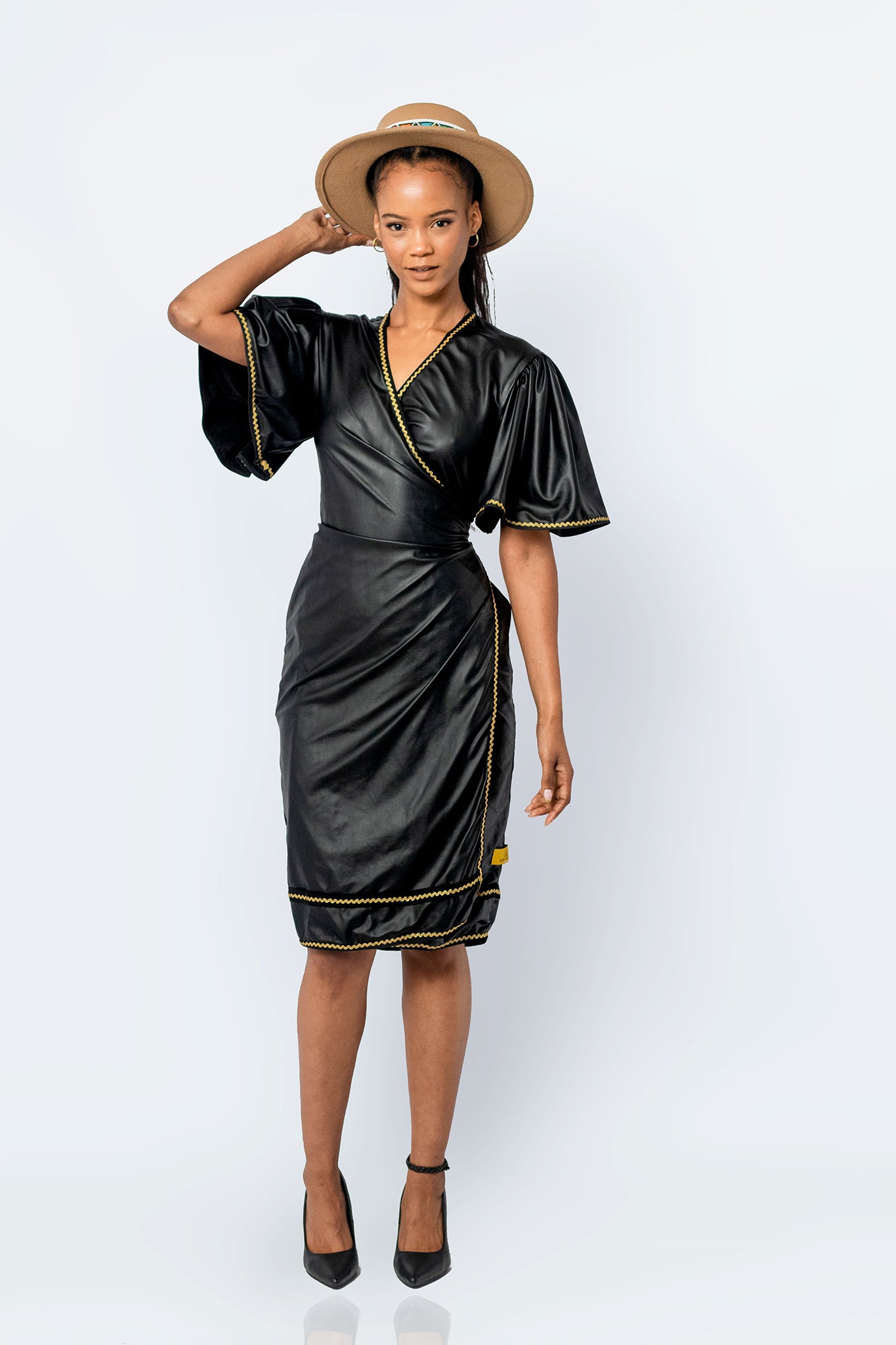 The black skin wrap around Silogadi dress with gold trim